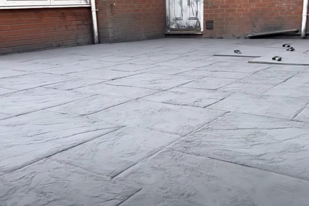 A photo of an imprinted concrete patio being done in a back garden in Huddersfield